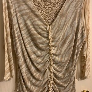i.e. brand tasteful animal print blouse w/small ruffles down the middle. Size L